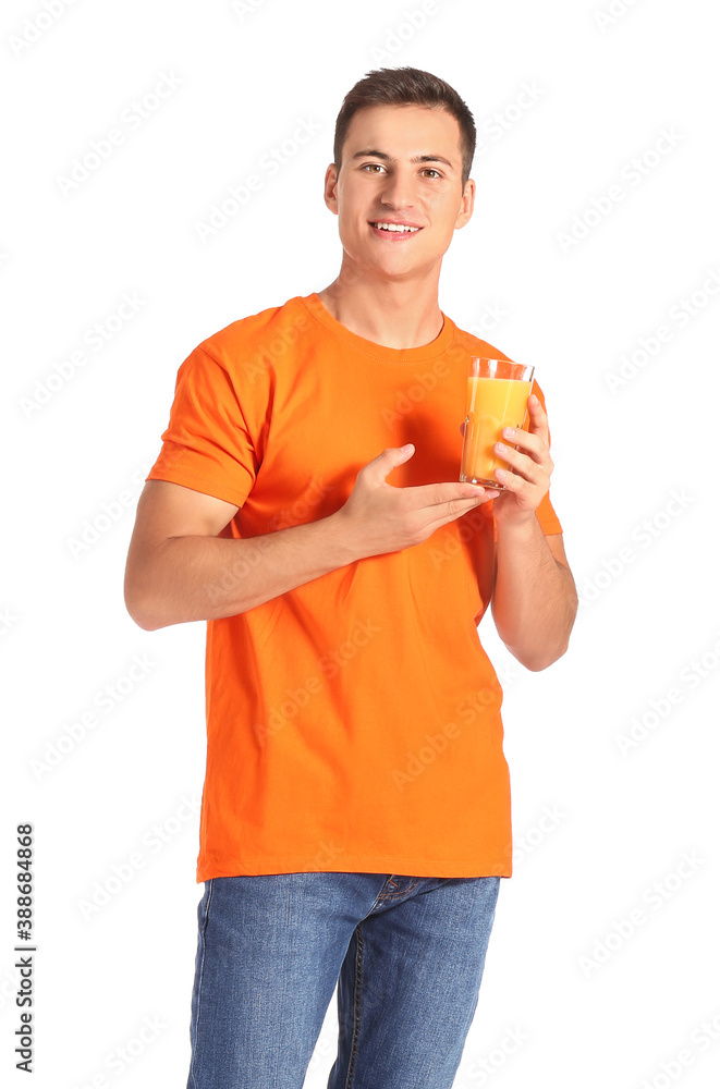 Handsome man with orange juice on white background