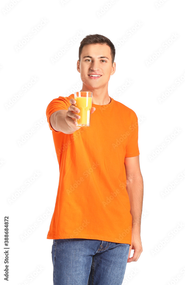 Handsome man with orange juice on white background