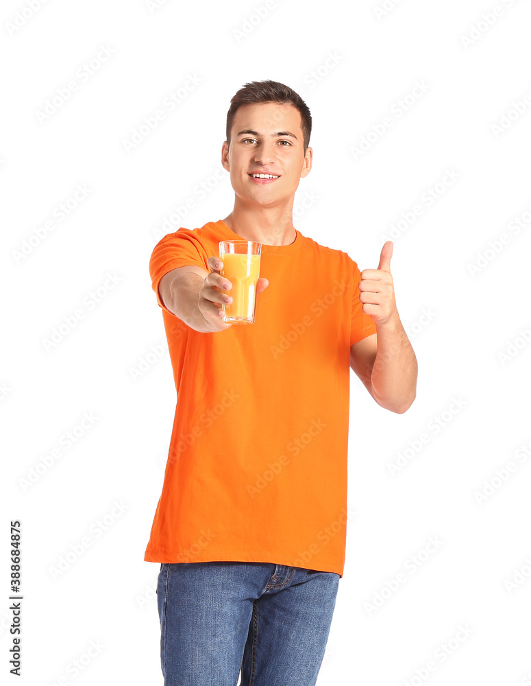 Handsome man with orange juice on white background