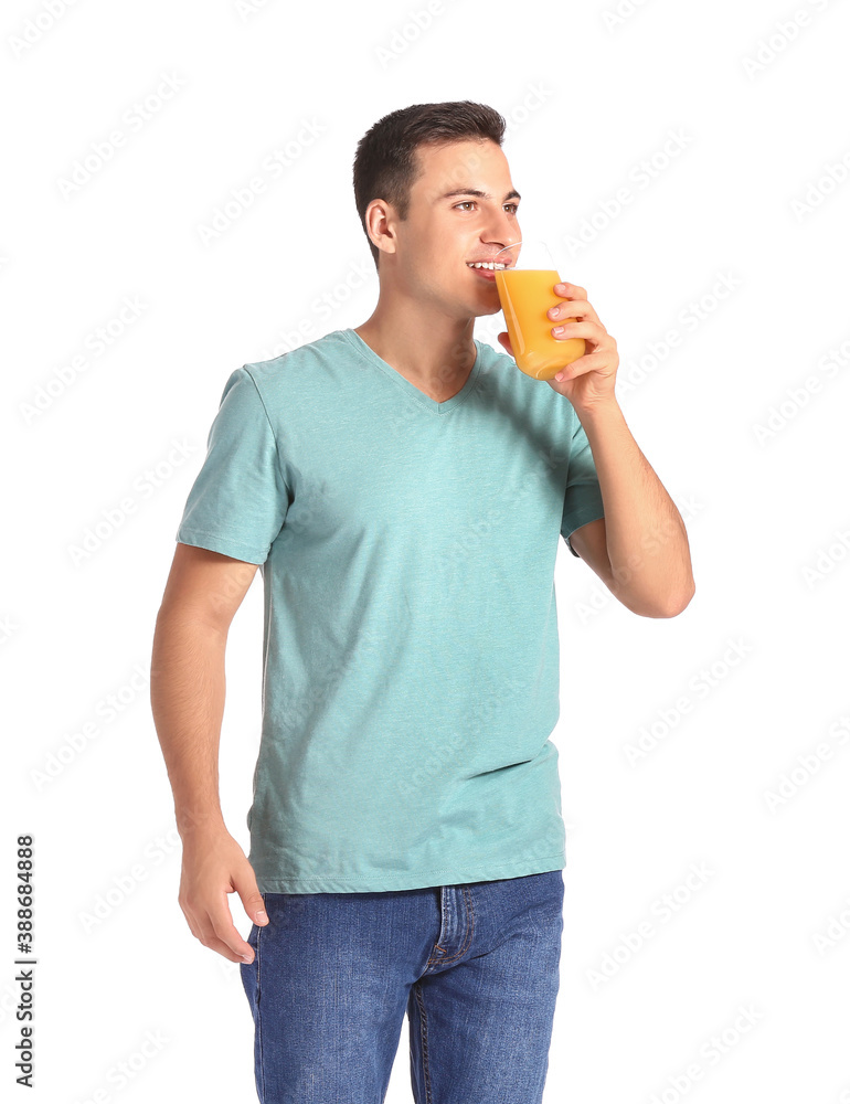 Handsome man with orange juice on white background