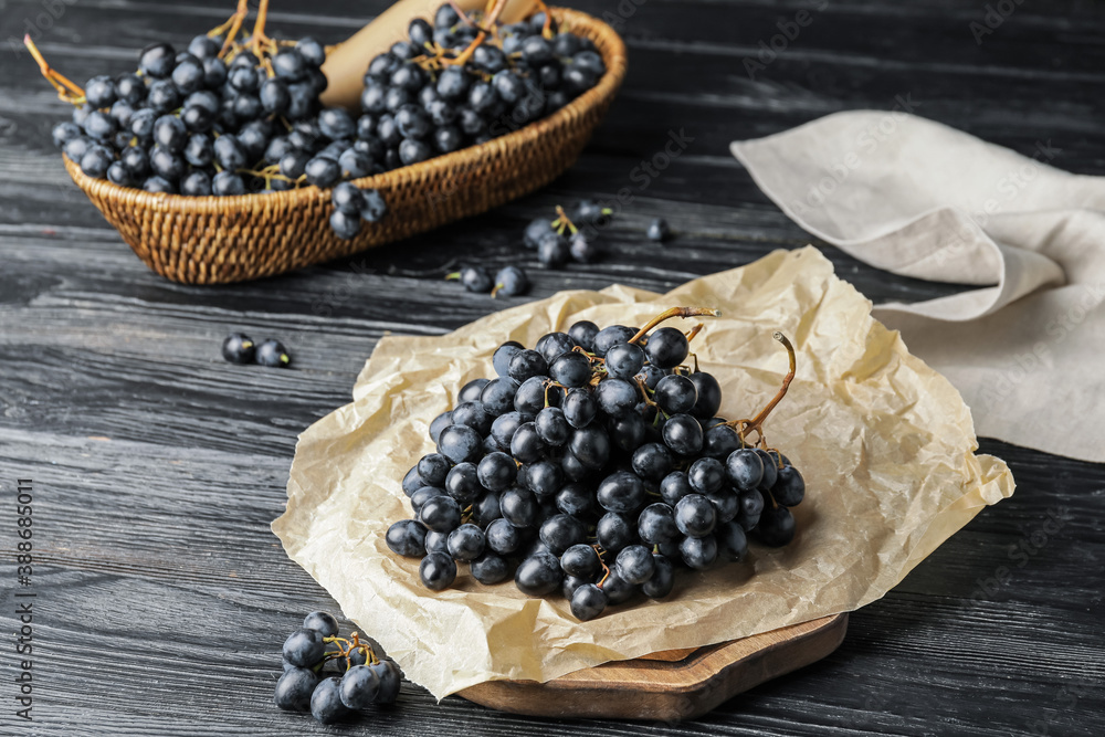 Sweet ripe grapes on table