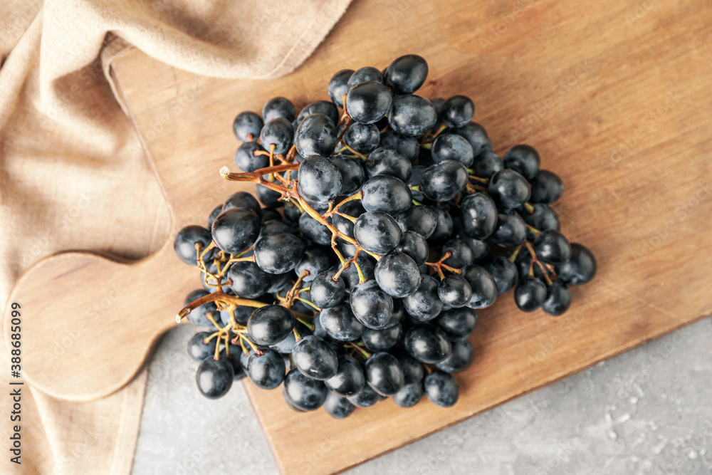 Sweet ripe grapes on table