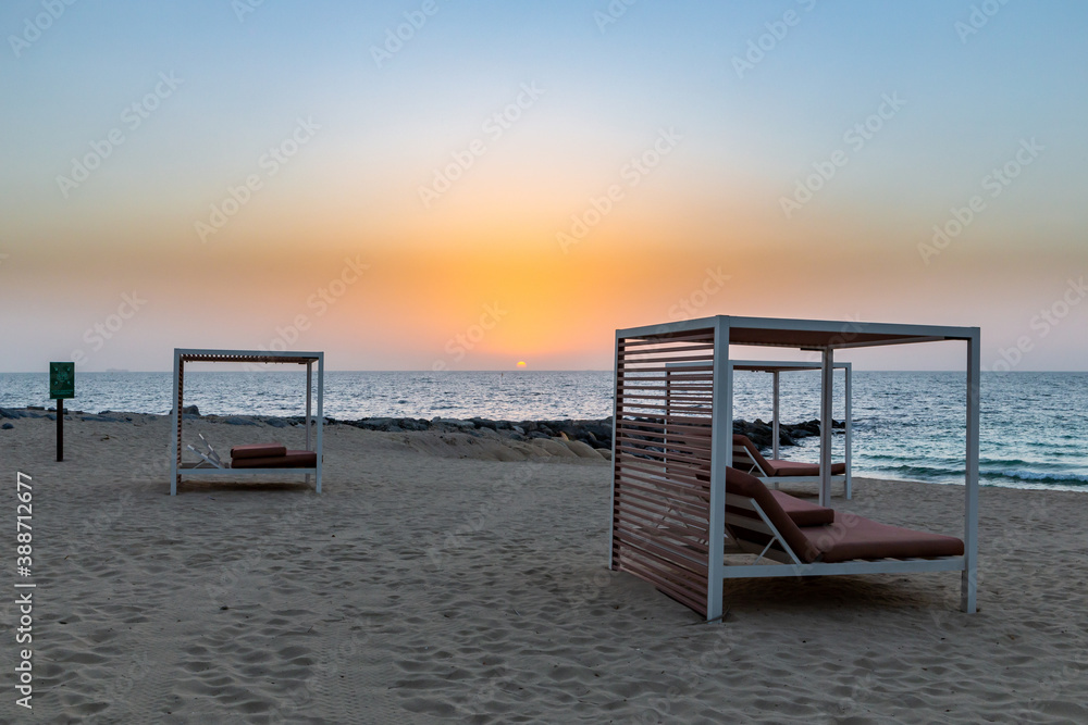 Empty sandy beach in Dubai with double sun beds, on new artificial Bluewaters Island, no people due 