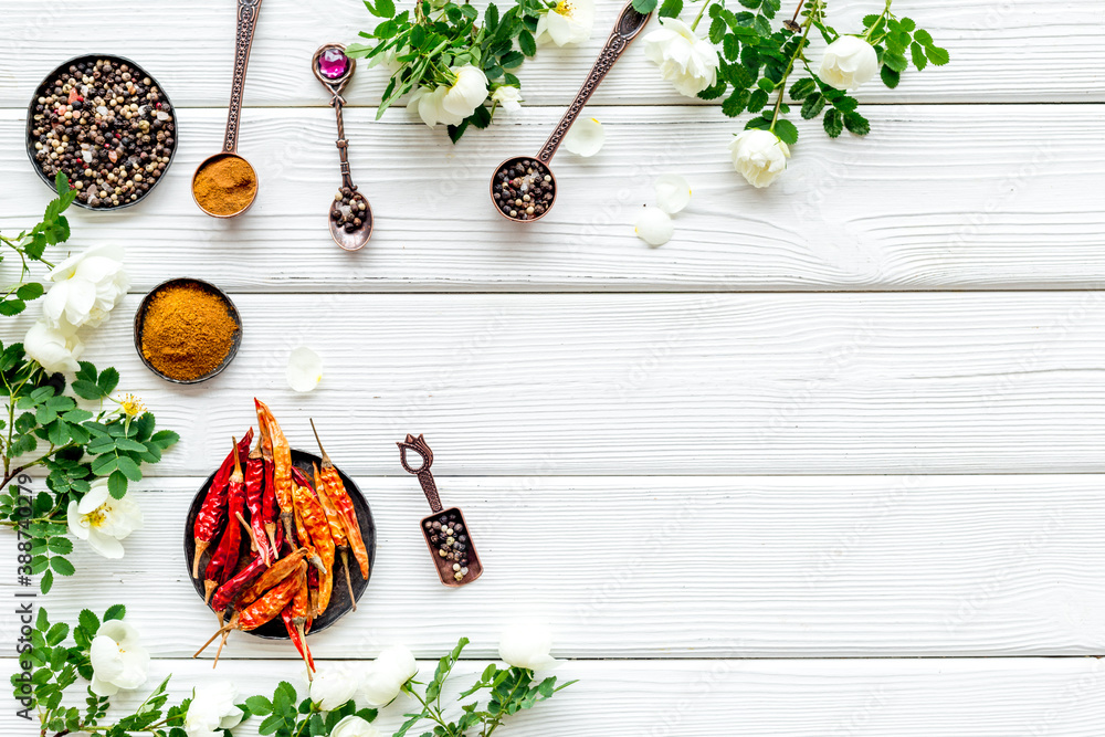 Set of hot Indian spices with flowers, top view