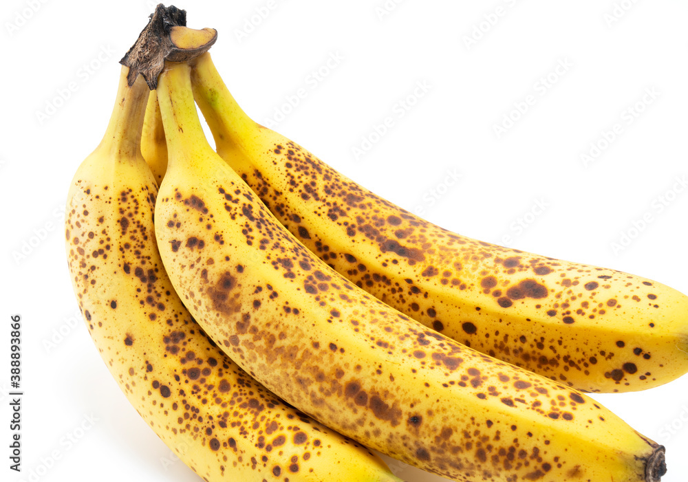 A banana out of a sugar pot placed on a white background