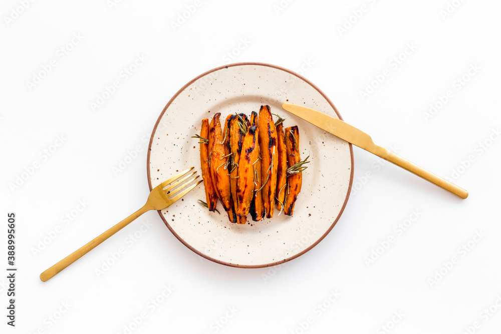 Top view of sweet potato fries with herbs and spices