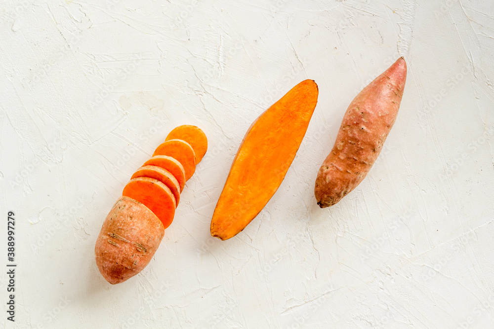 Pattern with sweet potato - yams. Organic vegetables background, overhead view