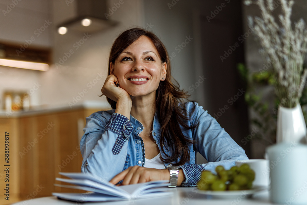 Casually dressed, brunette woman.