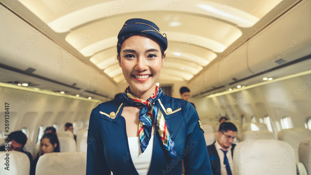 Cabin crew or air hostess working in airplane . Airline transportation and tourism concept.