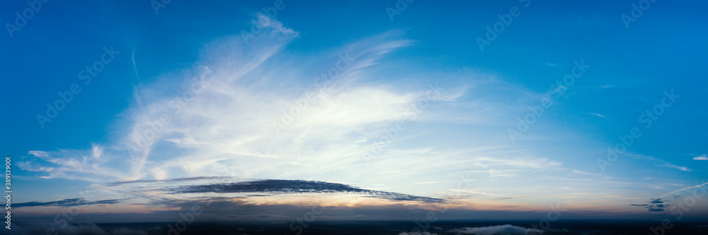 Dawn or sunset over the clouds, blue hour, aerial view.