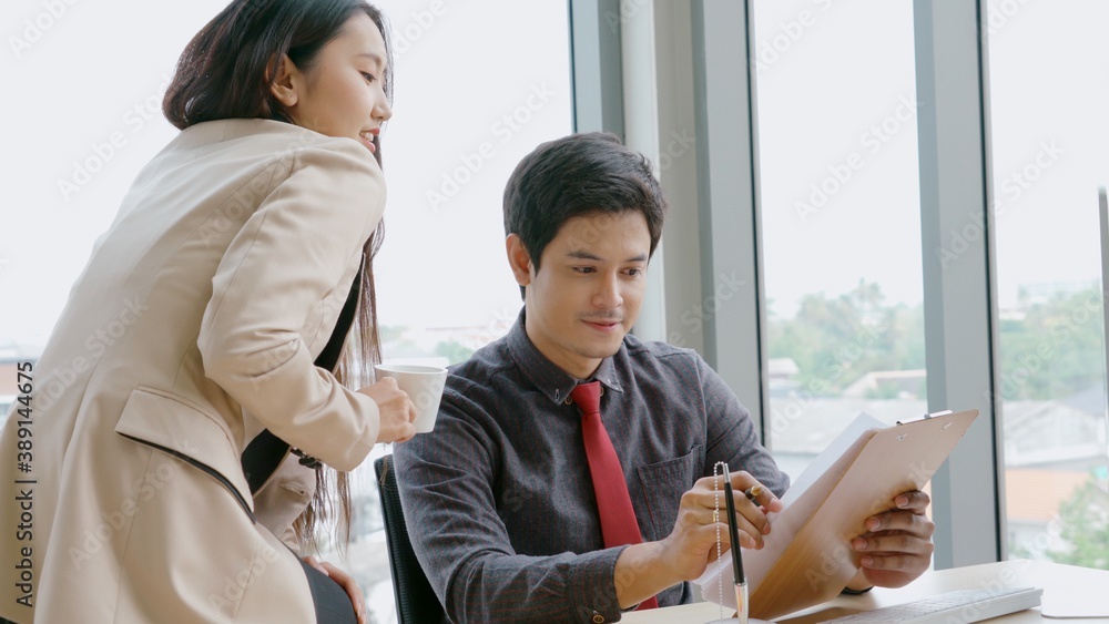 Two business people talk project strategy at office meeting room. Businessman discuss project planni