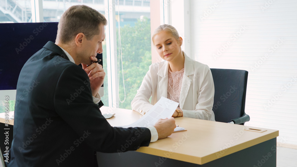 Job seeker in job interview meeting with manager and interviewer at corporate office. The young inte