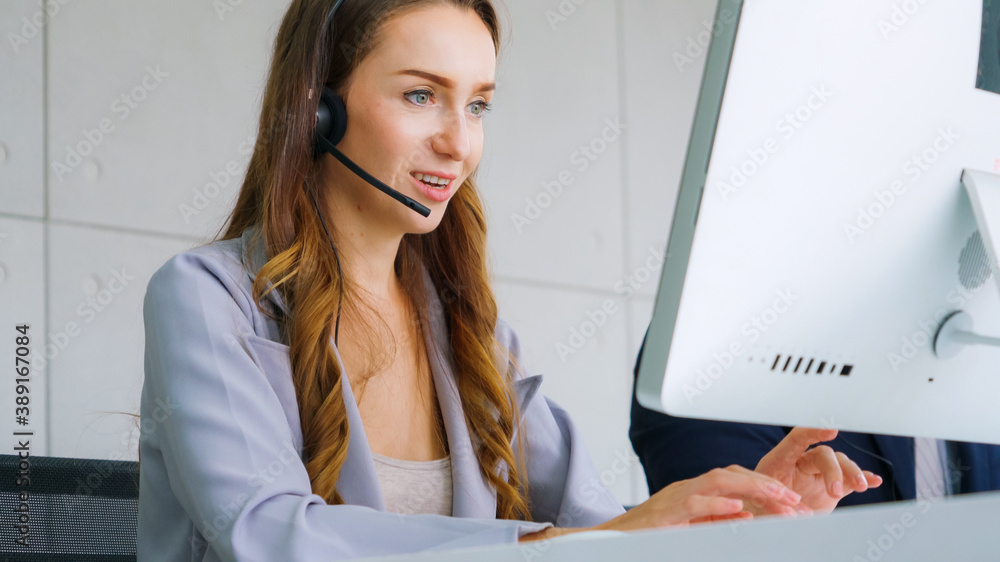 Business people wearing headset working in office to support remote customer or colleague. Call cent