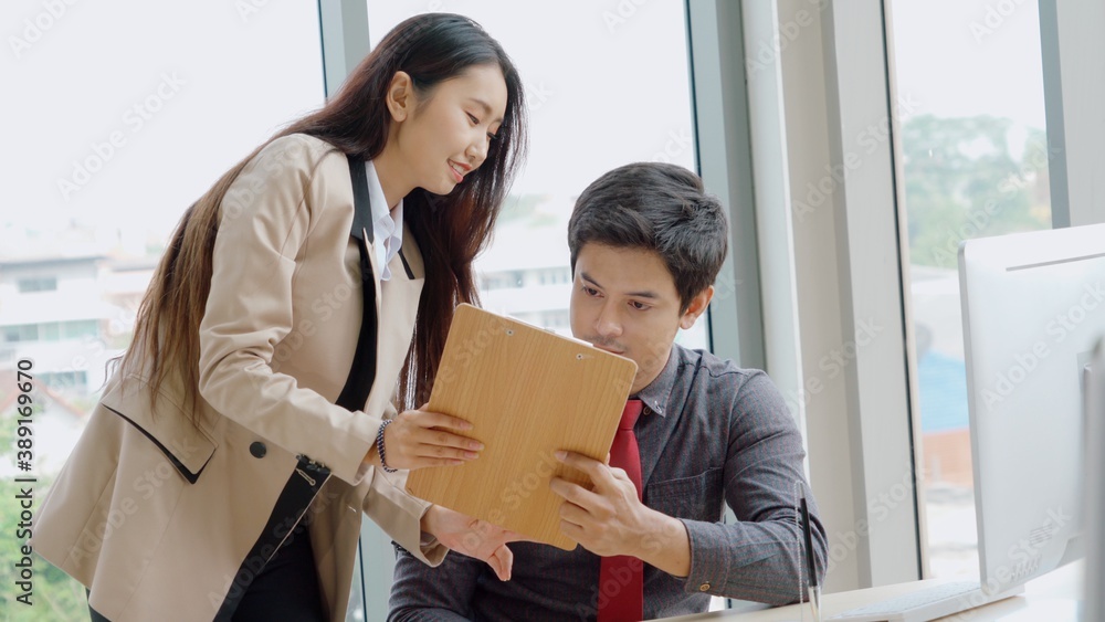 Two business people talk project strategy at office meeting room. Businessman discuss project planni