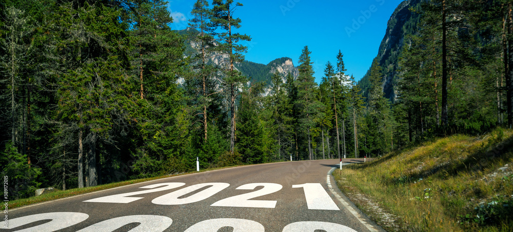 2021 New Year road trip travel and future vision concept . Nature landscape with highway road leadin