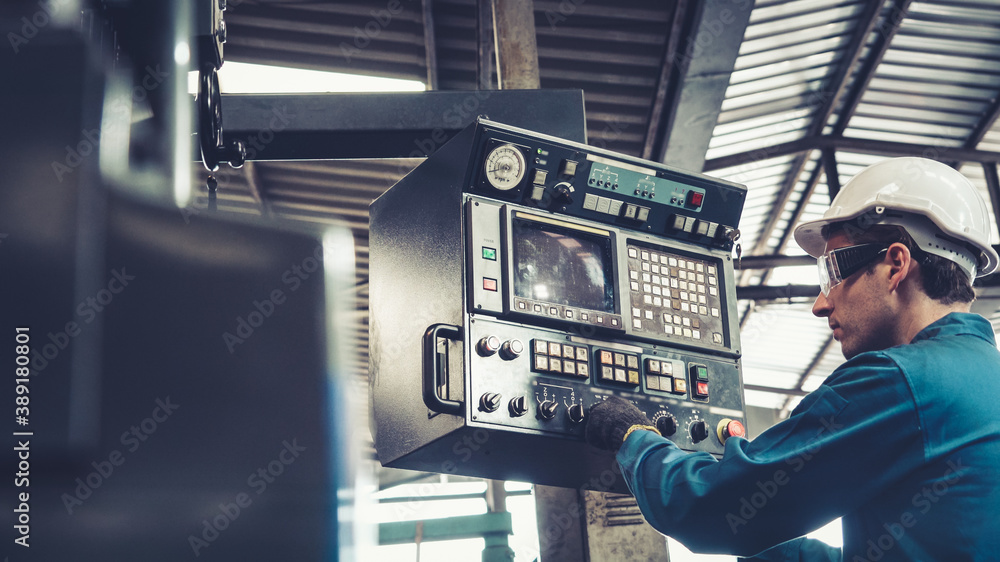 Smart factory worker using machine in factory workshop . Industry and engineering concept.