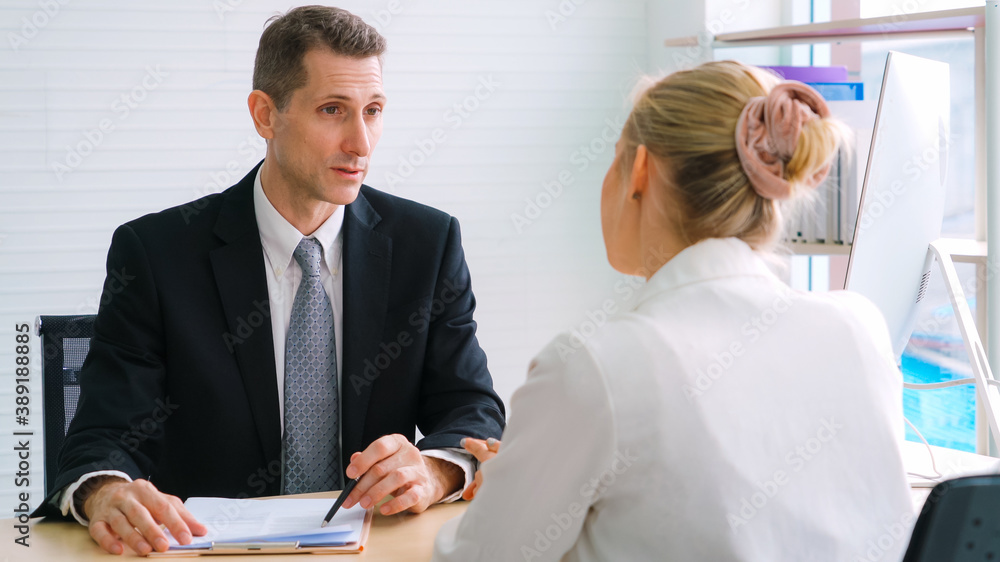 Job seeker in job interview meeting with manager and interviewer at corporate office. The young inte