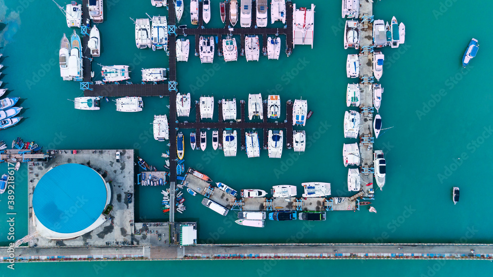 Aerial View Top down Drone shot of Yacht and sailboat parking in marina Transportation and travel ba