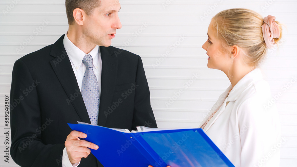 Two business people talk project strategy at office meeting room. Businessman discuss project planni