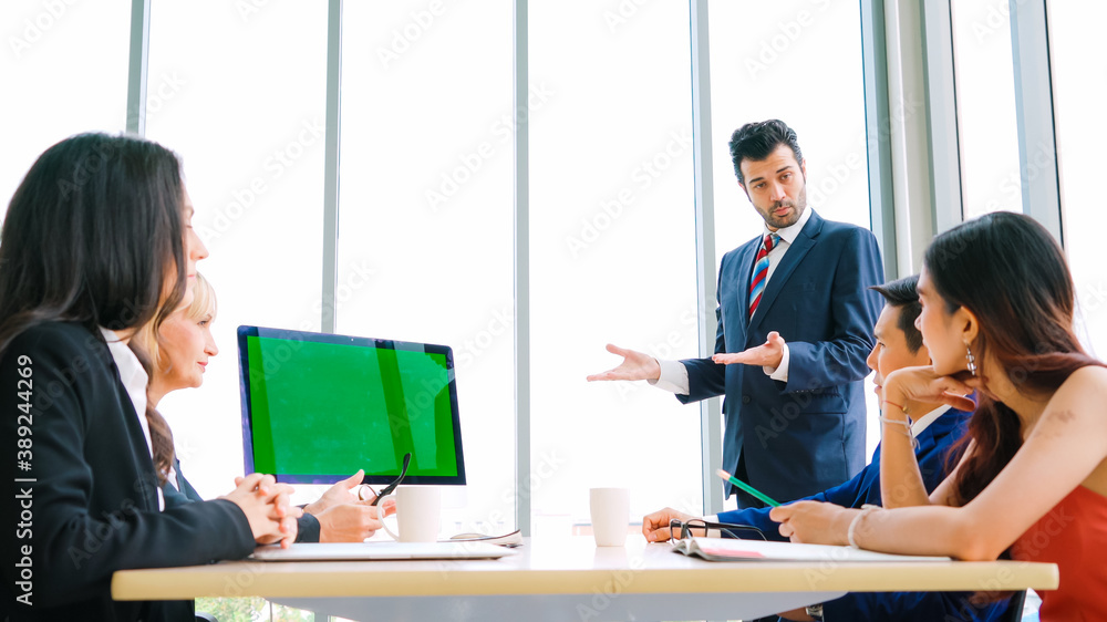 Business people in the conference room with green screen chroma key TV or computer on the office tab