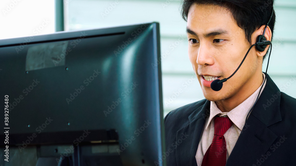 Business people wearing headset working in office to support remote customer or colleague. Call cent