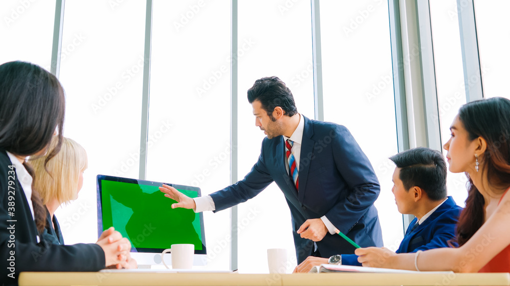 Business people in the conference room with green screen chroma key TV or computer on the office tab