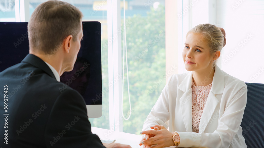 Job seeker in job interview meeting with manager and interviewer at corporate office. The young inte