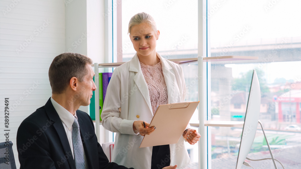 Two business people talk project strategy at office meeting room. Businessman discuss project planni