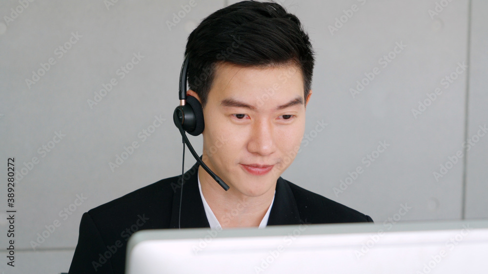 Business people wearing headset working in office to support remote customer or colleague. Call cent