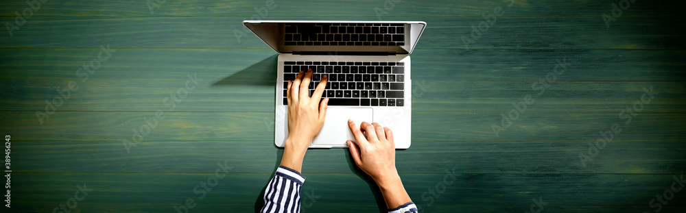 Person using a laptop computer from above