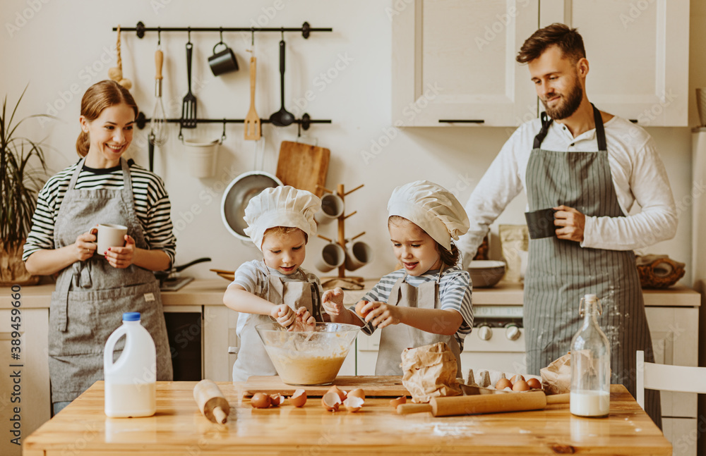 Positive family preparing pastry together.