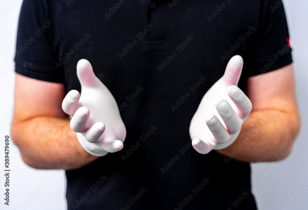 Dentists hands in latex white gloves. Selective focus. Cropped photo. Black uniform.