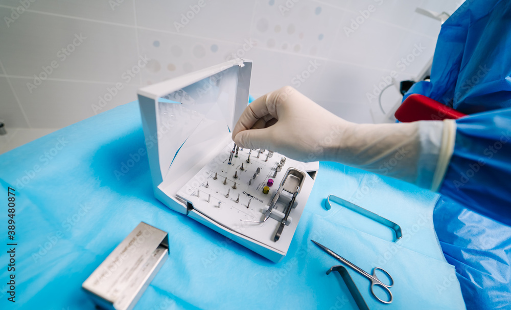 Set of metal dental tools for dental care and prosthetics. Selective focus.