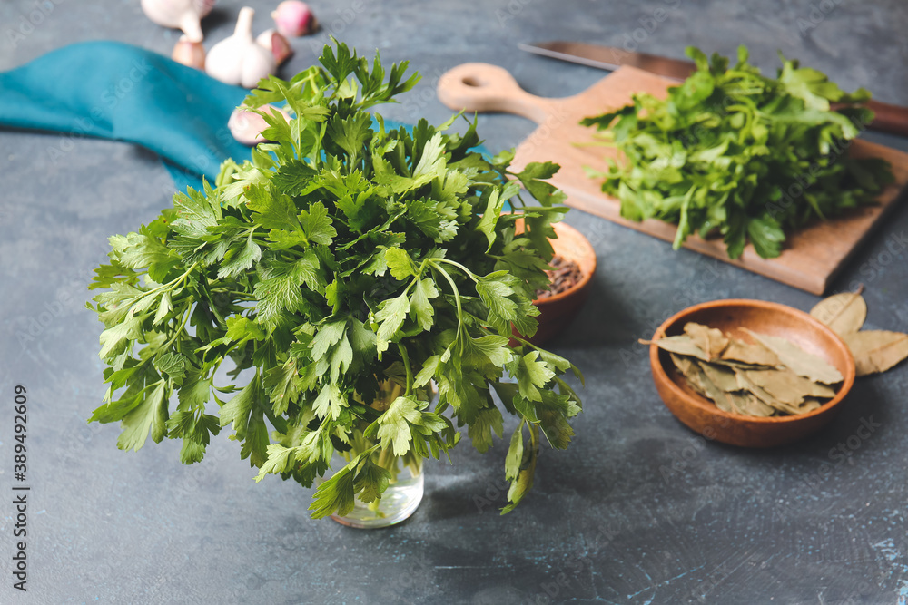 Fresh parsley and spices on table