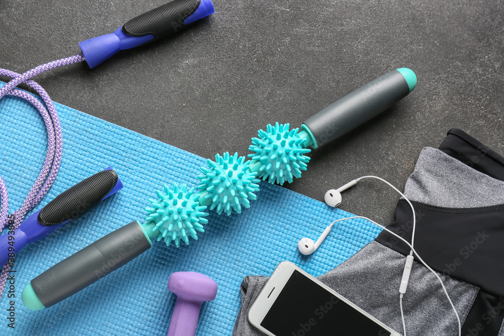 Sports equipment with body roller on dark background