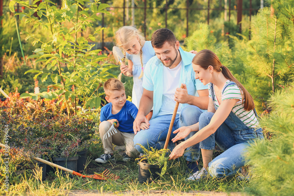 Young family working in garden