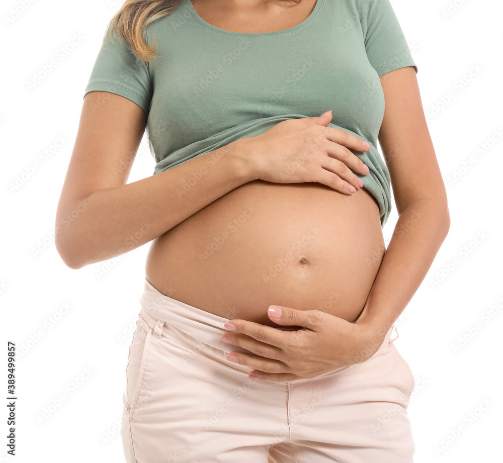 Beautiful pregnant woman on white background