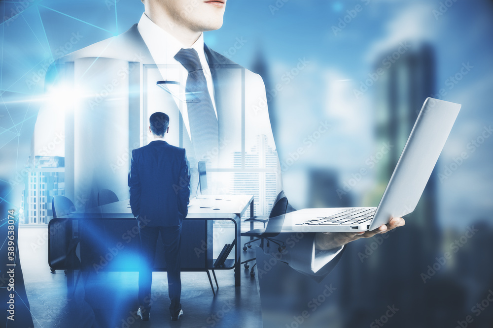 Businessman holding laptop with polygonal interface