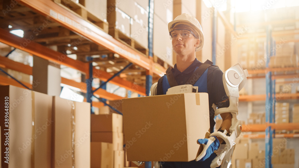 High-Tech Futuristic Warehouse: Worker Wearing Advanced Full Body Powered Exoskeleton, Walks with He