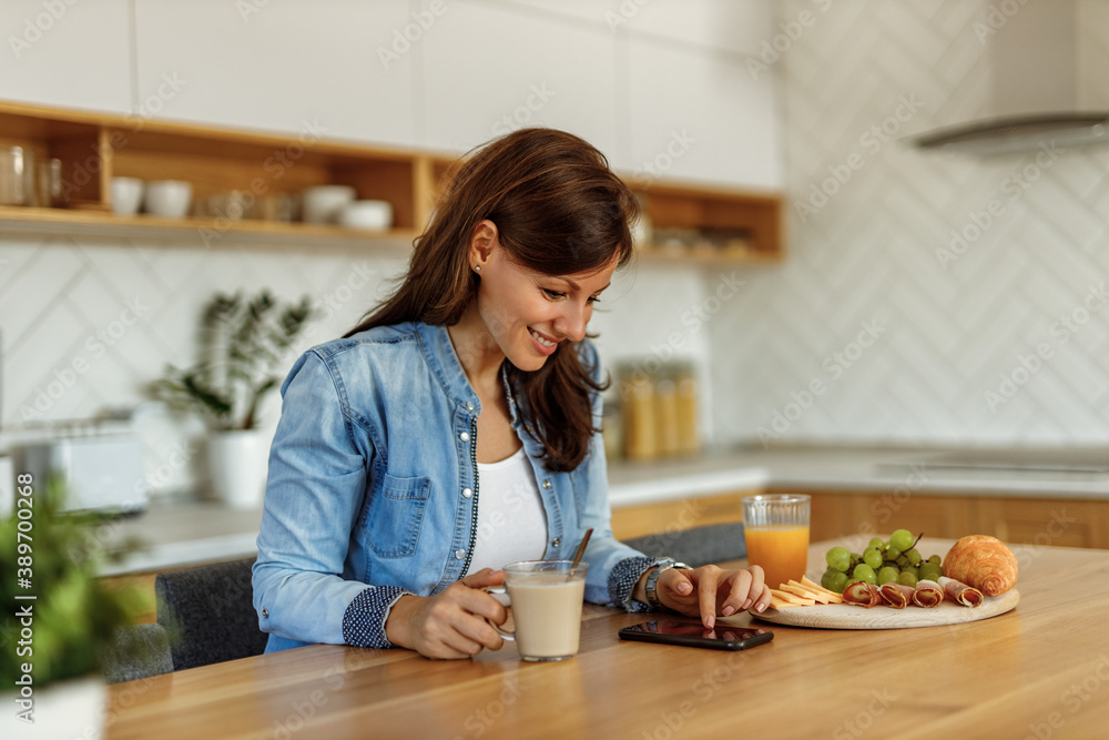 Drinking coffee, having breakfast.