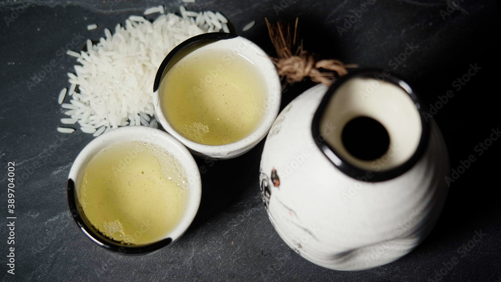 Pouring Sake Drink With Traditional Sake Cup and Sake Bottle