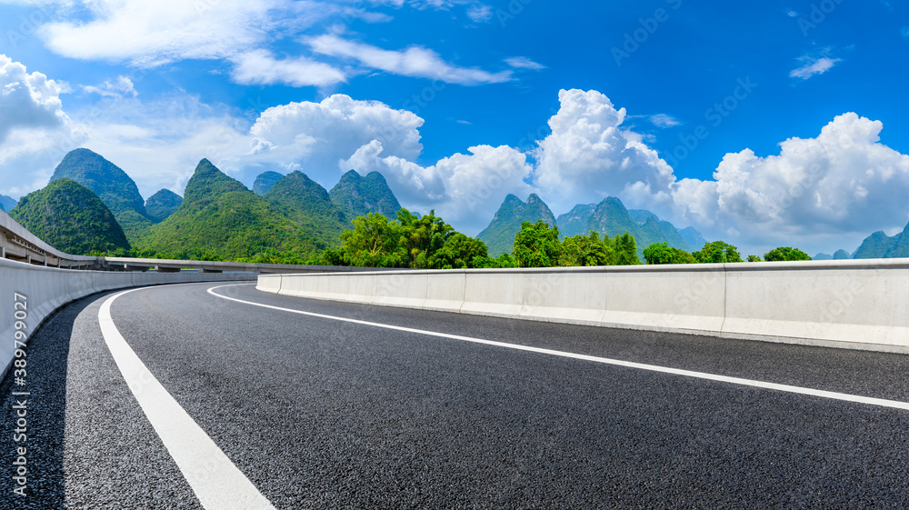 Country asphalt road and green mountain natural scenery in Guilin,China.