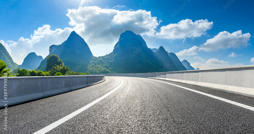 Country asphalt road and green mountain natural scenery in Guilin,China.