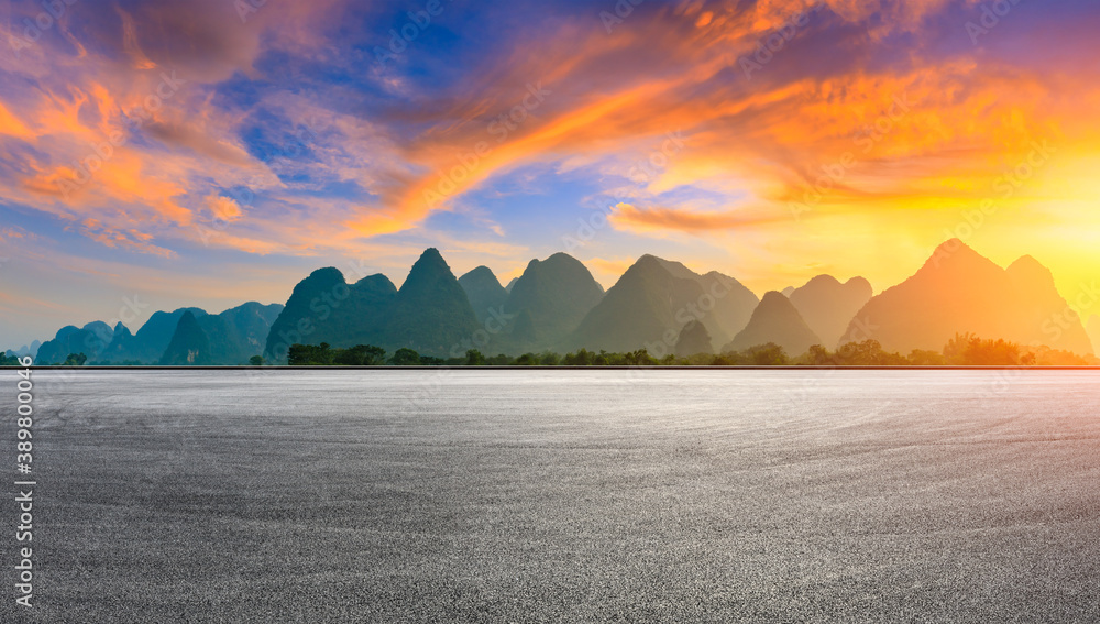 Asphalt race track and green mountain natural scenery in Guilin at sunrise,China.