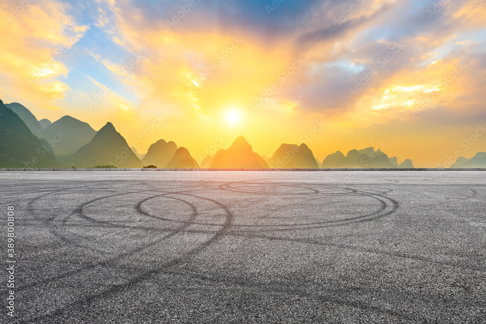 Asphalt race track and green mountain natural scenery in Guilin at sunrise,China.