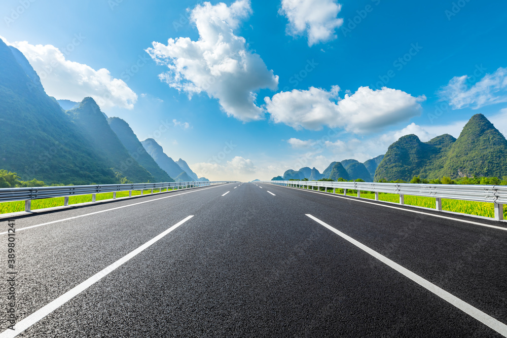 Asphalt highway and green mountain natural scenery in Guilin,China.