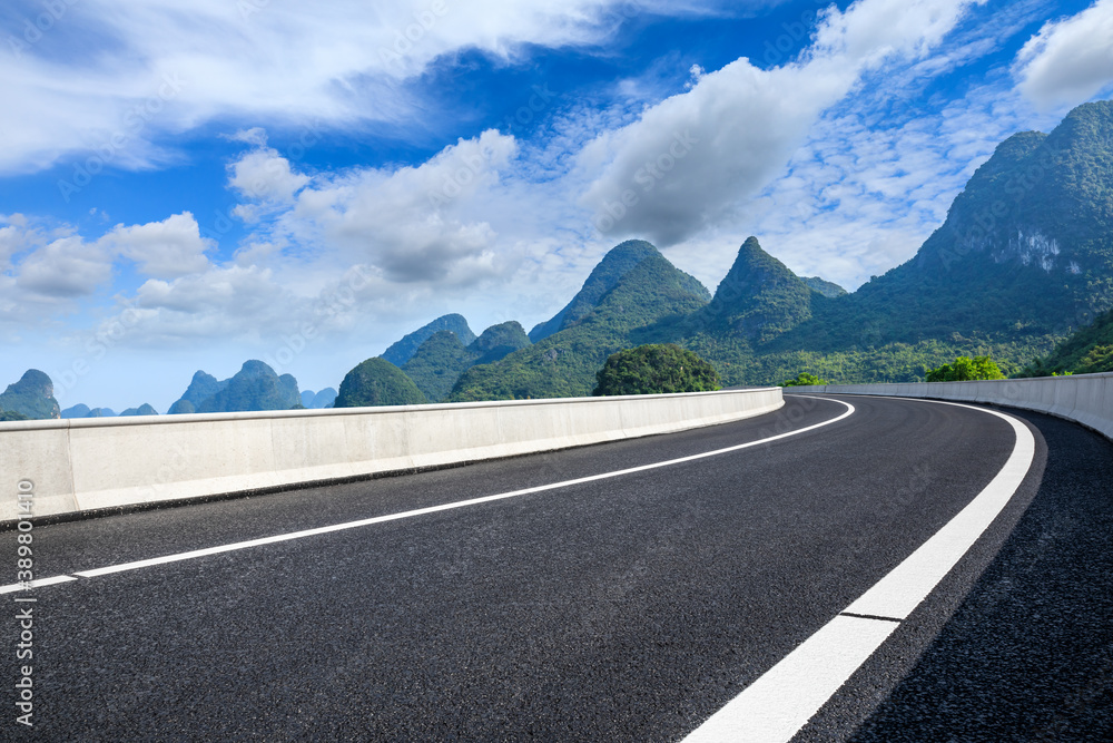 Asphalt highway and green mountain natural scenery in Guilin,China.