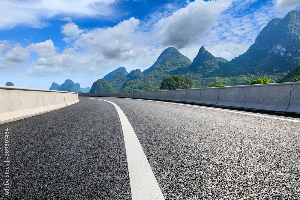 Asphalt highway and green mountain natural scenery in Guilin,China.