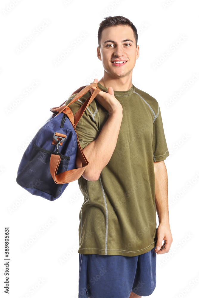 Young man with sports bag on white background