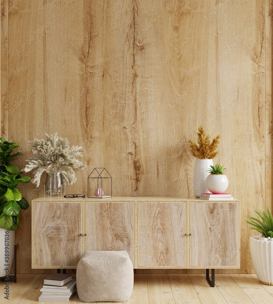 Cabinet in modern living room with decoration on wooden wall background.